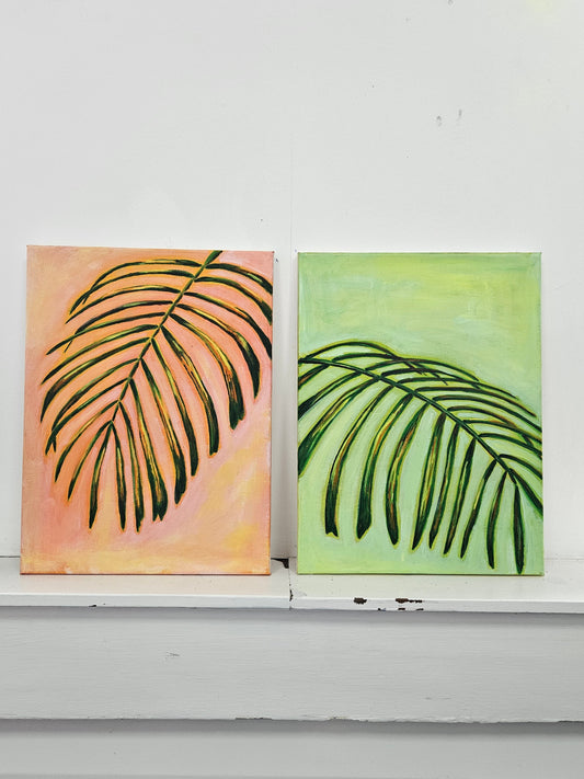 Two wall art pieces with leaf designs on a white background