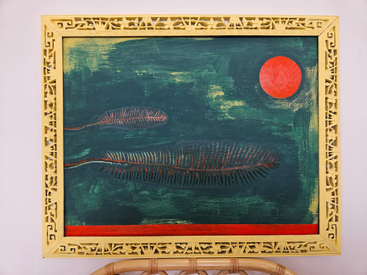 Two feathers in low contrast against a dark green background, with an orange sun and an orange stripe. Acrylic on wood. Handpainted ornate frame in pale yellow.