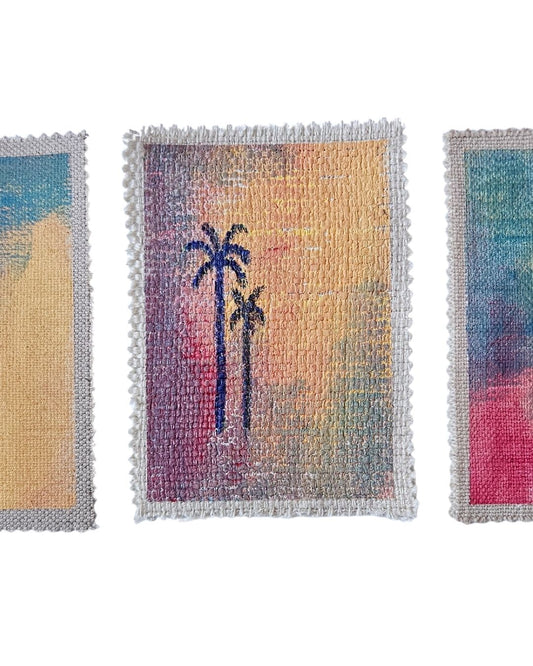 A close up of a palm tree painting on fabric