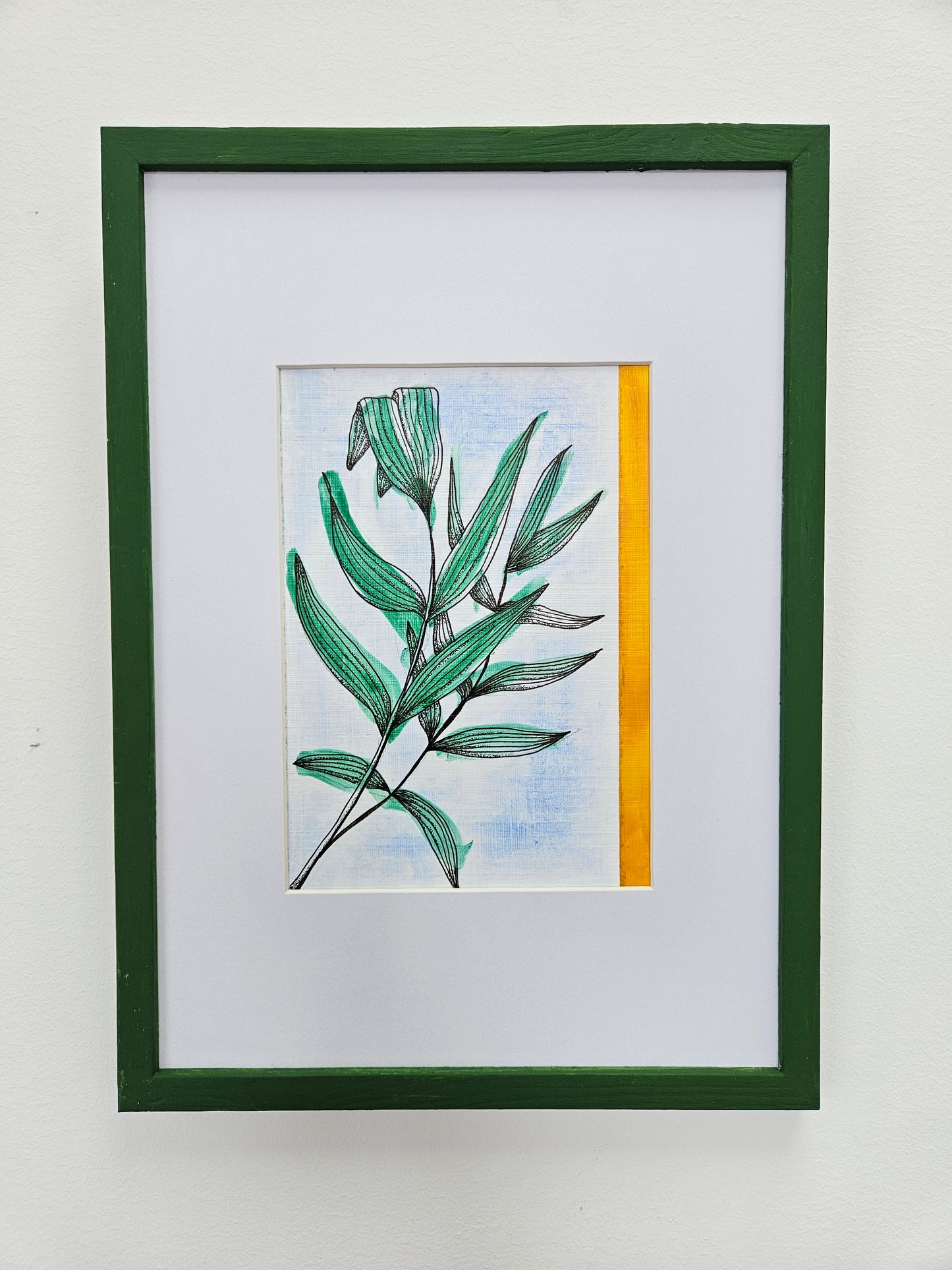 Botanical illustration of palm leaves, painted and with a yellow stripe down one side of the picture. White mount and green frame.