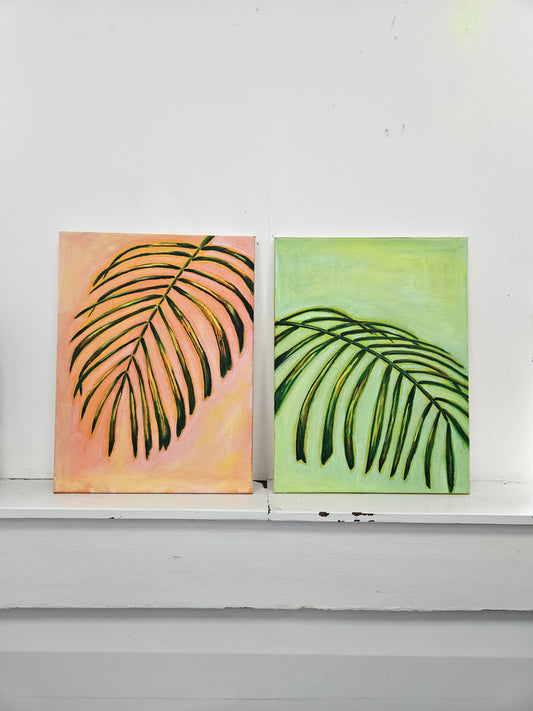 Two wall art pieces with leaf designs on a white background