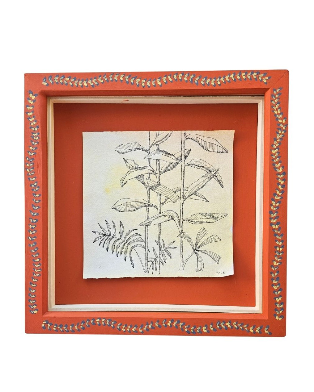 A square framed botanical art print featuring a black ink sketch of leaves and stems on textured cream paper, set within a terracotta orange frame which has a handpainted border