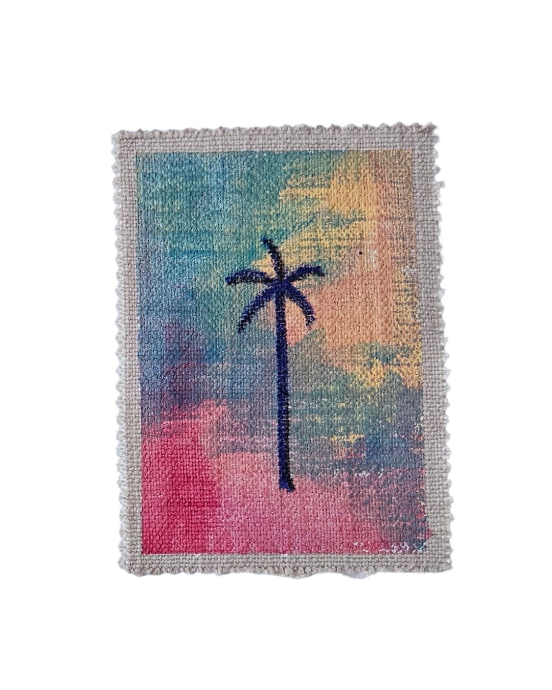 A painting of a blue palm tree on fabric