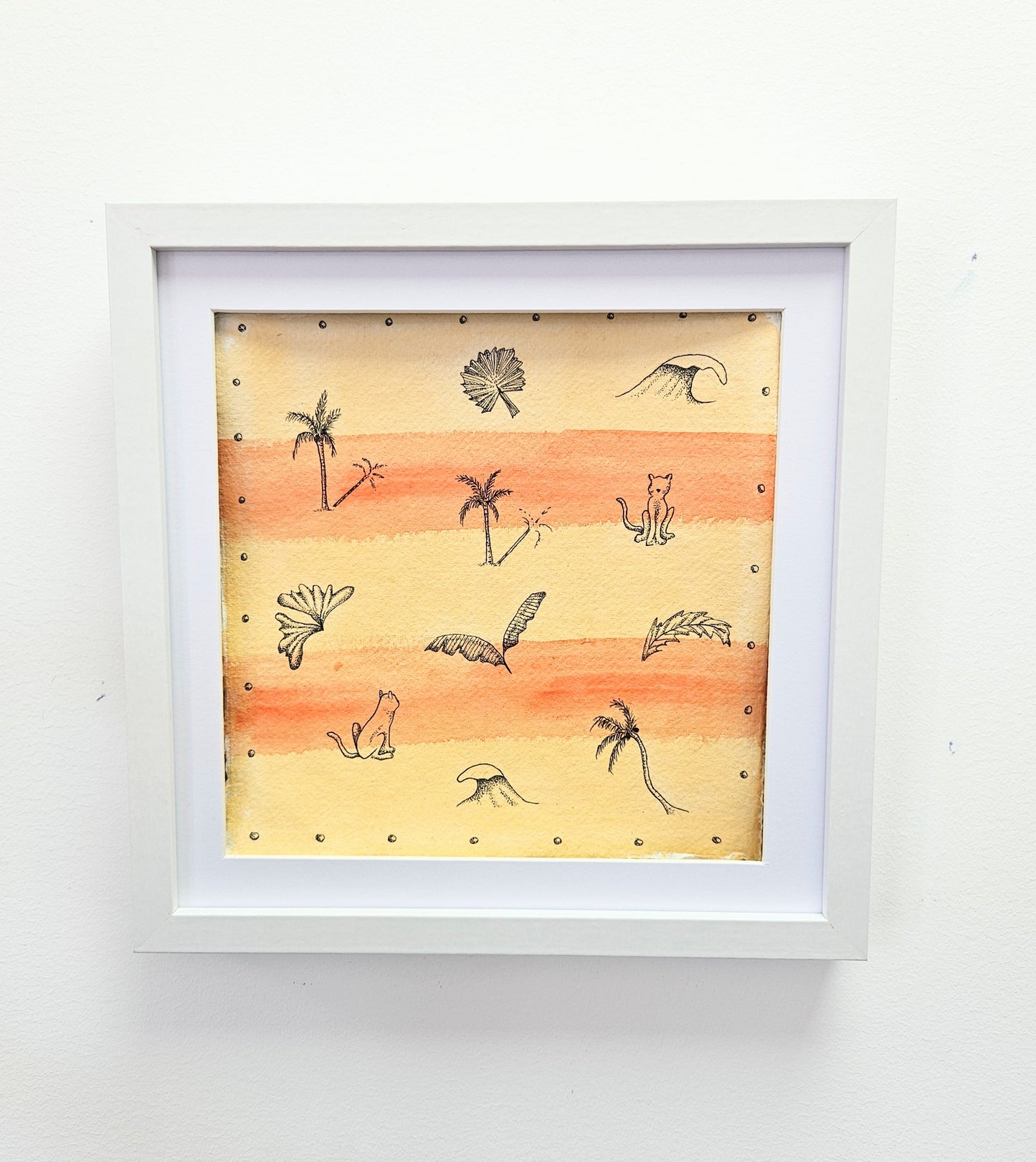 Framed illustrated artwork with a sunset background, featuring palm trees, waves, and cats.