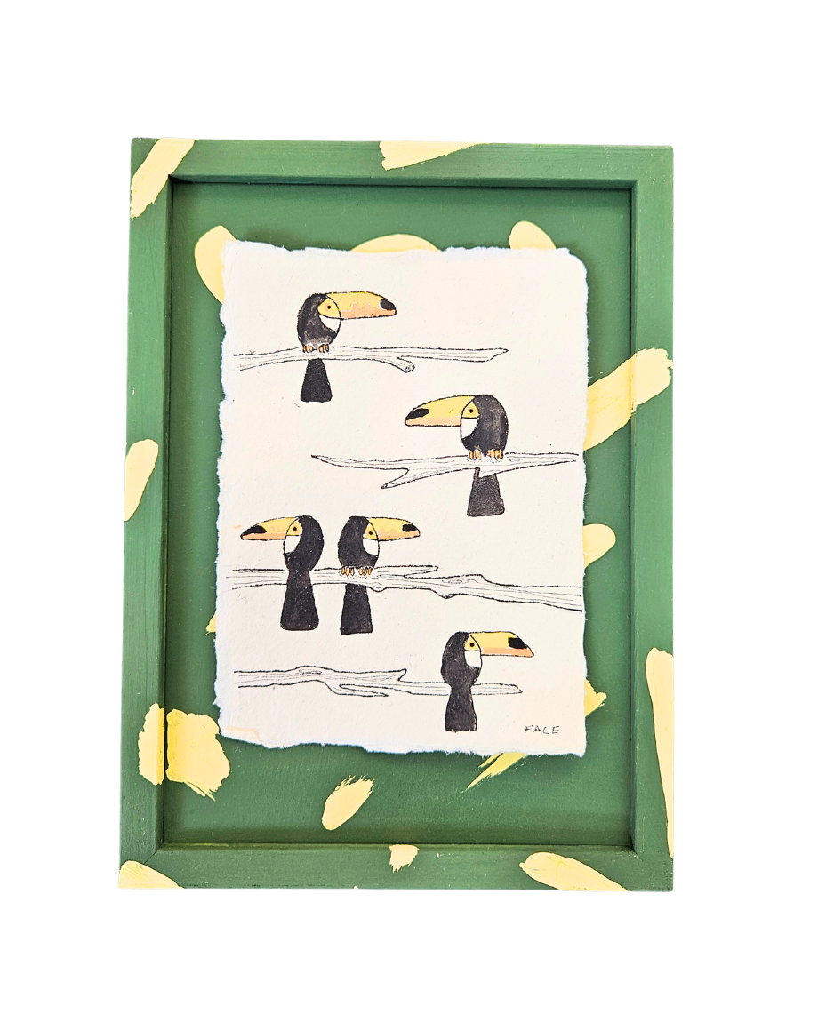 Framed artwork with toucan illustrations on a white background